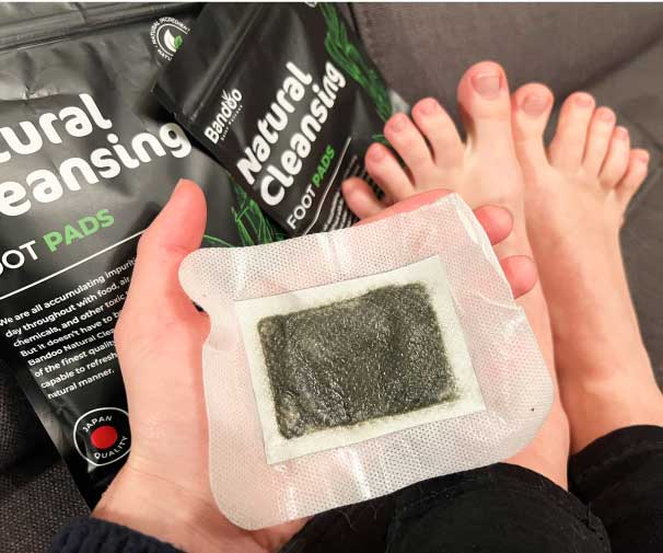 Person holding a used DetoxNatura foot patch