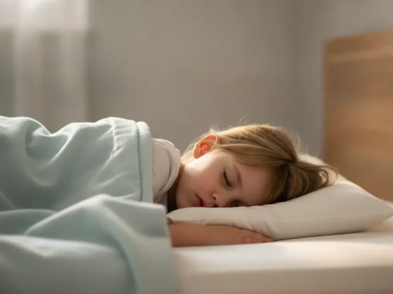 Child sleeping on their side on a low, thin pillow, with the head and neck aligned.